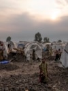 FILE - People displaced by the ongoing fighting gather at refugee camp on the outskirts of Goma, Democratic Republic of the Congo, July 11, 2024.