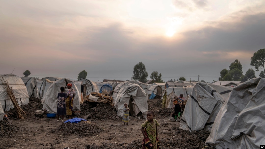 FILE - People displaced by the ongoing fighting gather at refugee camp on the outskirts of Goma, Democratic Republic of the Congo, July 11, 2024.