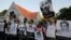 FILE - Members of the Sri Lankan media hold portraits of journalists abducted and killed during the final stage of the country's civil war, during a protest in Colombo, Sri Lanka, Jan. 29, 2019.
