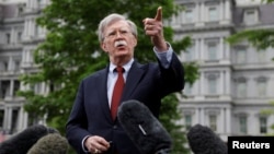 U.S. national security adviser John Bolton talks to reporters at the White House in Washington, May 1, 2019.