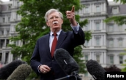 FILE - U.S. national security adviser John Bolton talks to reporters at the White House in Washington, May 1, 2019.