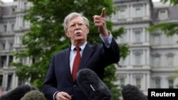 FILE - President's Donald Trump's National Security Adviser John Bolton talks to reporters at the White House in Washington, May 1, 2019. 