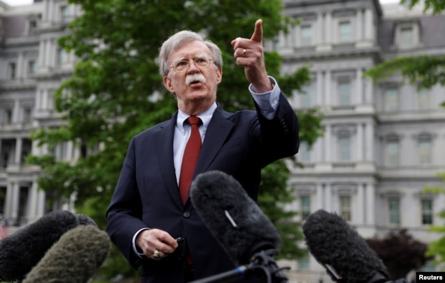 FILE - U.S. national security adviser John Bolton talks to reporters at the White House in Washington, May 1, 2019.