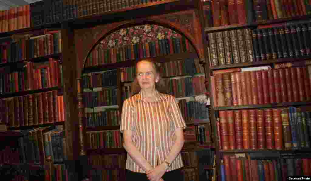 Love inside the museum’s extensive library, which is musty from the many leather-bound books on its shelves, dating back to the 1800s. Photo by Darren Taylor.