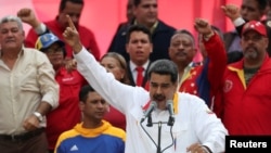 FILE - Venezuela's President Nicolas Maduro talks during a rally in support of the government in Caracas, Venezuela, May 20, 2019.