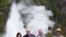 U.S. Vice President Mike Pence, with wife Karen, Interior Secretary David Bernhardt and Yellowstone National Park Superintendent Cam Sholly, speaks in front of Old Faithful Geyser in Yellowstone National Park in Wyoming, June 13, 2019. 