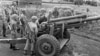 Gen. Maxwell Taylor, President John F. Kennedy's special military adviser, examines a South Vietnamese cannon during a tour of the border between North and South Vietnam, Oct. 22, 1961. 