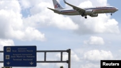 FILE- An American Airlines airplane prepares to land at Jose Marti International Airport in Havana, Cuba 