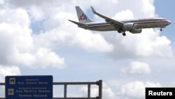 FILE - An American Airlines airplane prepares to land at Jose Marti International Airport in Havana, Cuba, Sept. 19, 2015. 