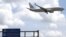 FILE - An American Airlines airplane prepares to land at Jose Marti International Airport in Havana, Cuba, Sept. 19, 2015. 