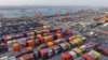 An aerial view shows containers at the port in Nanjing, in China's eastern Jiangsu province, Feb. 4, 2025. China said it would impose tariffs on imports of US energy, vehicles and equipment, 