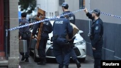 Police raid a property in the Sydney suburb of Surry Hills, Australia, July 31, 2017, in the wake of a plot again Australia's aviation sector.