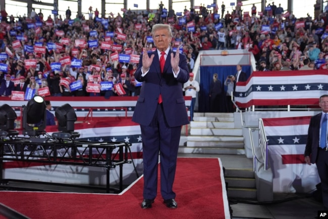 Republican presidential nominee former President Donald Trump arrives to speak at a campaign rally at J.S. Dorton Arena, Monday, Nov. 4, 2024, in Raleigh, N.C. (AP Photo/Evan Vucci)