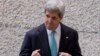 File - United States Secretary of State John Kerry raises his fists into a fighting stance, as he leaves an event marking the launch of the Cleantech Challenge Mexico 2014, in Mexico City earlier this month.