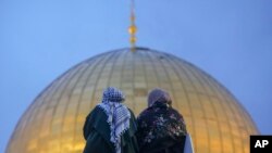 FILE—Palestinians gather for Eid al-Fitr prayers by the Dome of the Rock shrine in the Al Aqsa Mosque compound in Jerusalem's Old City, April 10, 2024. 