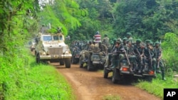 Patrouille mixte ONU-FARDC près de la zone d'une attaque aux ADF à environ 30 km de Beni, en République démocratique du Congo, le 23 juillet 2021. 