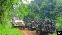 File - Congolese Defense Forces soldiers and United Nation forces patrol the area of an attack in Democratic Republic of Congo, July 23, 2021, and the Allied Democratic Forces (ADF) is now suspected of ambushing a convoy.