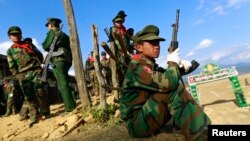 FILE - A TNLA (Ta'ang National Liberation Army) soldier looks on during the 51st anniversary of the Ta'ang National Resistance Day at Homain, Nansan township in the northern Shan state, Jan. 12, 2014.