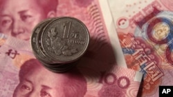Mata uang China, Yuan, mengalami devaluasi untuk hari kedua berturut-turut (foto: dok).