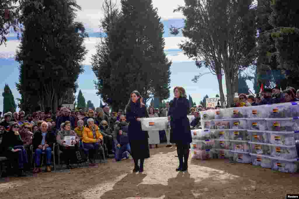 Members of the Association for the Recovery of Historical Memory of Valladolid (ARMH-Valladolid) take part in the burial of 245 people killed by the late Spanish dictator Francisco Franco&#39;s forces during the civil war, that were exhumed between 2016 and 2017, at El Carmen&#39;s cemetery in Valladolid, Spain.