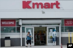 An empty-handed customer exits the only Kmart store left in the continental United States on Oct. 22, 2024, in Miami, Florida.