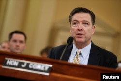 FILE - FBI Director James Comey testifies before the House Intelligence Committee hearing into alleged Russian meddling in the 2016 U.S. election, on Capitol Hill in Washington, March 20, 2017.