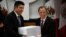 Mexico's Finance Minister Jose Antonio Meade (R) hands over the 2017 budget to the Chamber of Deputies chairman Javier Bolanos in Mexico City, Mexico, Sept. 8, 2016. 