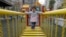 A child walks on a swinging bridge at a kindergarten in Wuhan, Hubei province, December 3, 2012.