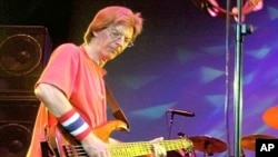 FILE - Phil Lesh of the Grateful Dead performs during a reunion concert in East Troy, Wis. Aug. 3, 2002. Lesh, a founding member of the Grateful Dead, died Oct. 25, 2024, at age 84.