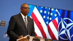U.S. Defense Secretary Lloyd Austin speaks during a media conference after a meeting of NATO defense ministers at NATO headquarters in Brussels, Oct. 22, 2021.