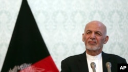 Afghan President Ashraf Ghani, listens during a press conference with NATO Secretary General Jens Stoltenberg, at the presidential palace, in Kabul, Afghanistan, Nov. 6, 2018.