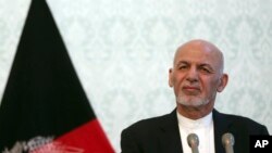 Afghan President Ashraf Ghani, listens during a press conference with NATO Secretary General Jens Stoltenberg, at the presidential palace, in Kabul, Afghanistan, Nov. 6, 2018.