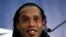 Brazilian national soccer team player Ronaldinho smiles during a news conference at Wembley stadium in London February 5, 2013. Brazil are set to play England in an international friendly soccer match on Wednesday. REUTERS/Stefan Wermuth (BRITAIN - Tags: