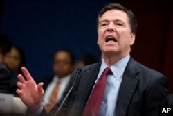 FBI Director James Comey tells the U.S. House Intelligence Committee hearing that the Justice Department’s dispute with Apple Inc. represents the ‘hardest question I've seen in government,’ on Capitol Hill, Washington, Feb. 25, 2016.