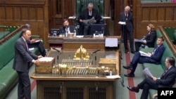 A video grab from footage broadcast by the UK Parliament's Parliamentary Recording Unit (PRU) shows Britain's Health Secretary Matt Hancock (L) giving a statement on coronavirus, Sept. 10, 2020. 