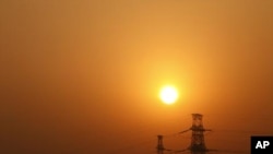 Electricity pylons in Beijing. China has invested $30 billion to boost energy conservation and curb greenhouse gas emissions in the past five years.