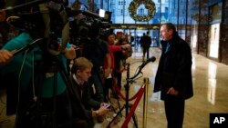 Former CIA director and retired Gen. David Petraeus talks with reporters after a meeting with President-elect Donald Trump, Nov. 28, 2016, in New York. 