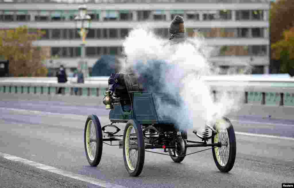 People taking part in the &quot;London to Brighton Veteran Car Run&quot; cross Westminster Bridge in London, Nov. 7, 2021.