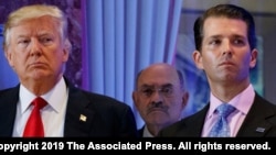  FILE - This file photo from Jan. 11, 2017, shows Donald Trump, left, his chief financial officer Allen Weisselberg, center, and his son Donald Trump Jr., right, during a news conference at Trump Tower in New York.