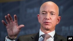 FILE - Jeff Bezos, Amazon founder and CEO, speaks in Washington, Sept. 13, 2018.