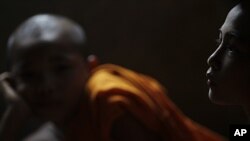 FILE - Karen novice monks attend class in Mae La refugee camp near Mae Sot, Thailand. Thai police say the former abbot of a prominent Buddhist monastery has been arrested in the scandal.