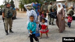 Penaberên Kurd ji Kobanê tên Sirucê