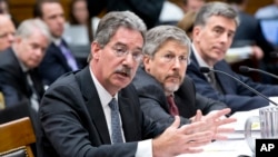 From left to right, Deputy Attorney General James Cole, Robert S. Litt, general counsel in the Office of Director of National Intelligence, NSA Deputy Director John C. Inglis, testify at a House Judiciary hearing on domestic spying on on Capitol Hill, July 17, 2013.