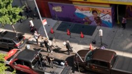 Members of the NY Phil Bandwagon perform outside the Casita Maria Center For Arts & Education in the Hunts Point neighborhood of the Bronx borough of New York, Friday, Oct. 2, 2020. (AP Photo/Mary Altaffer)