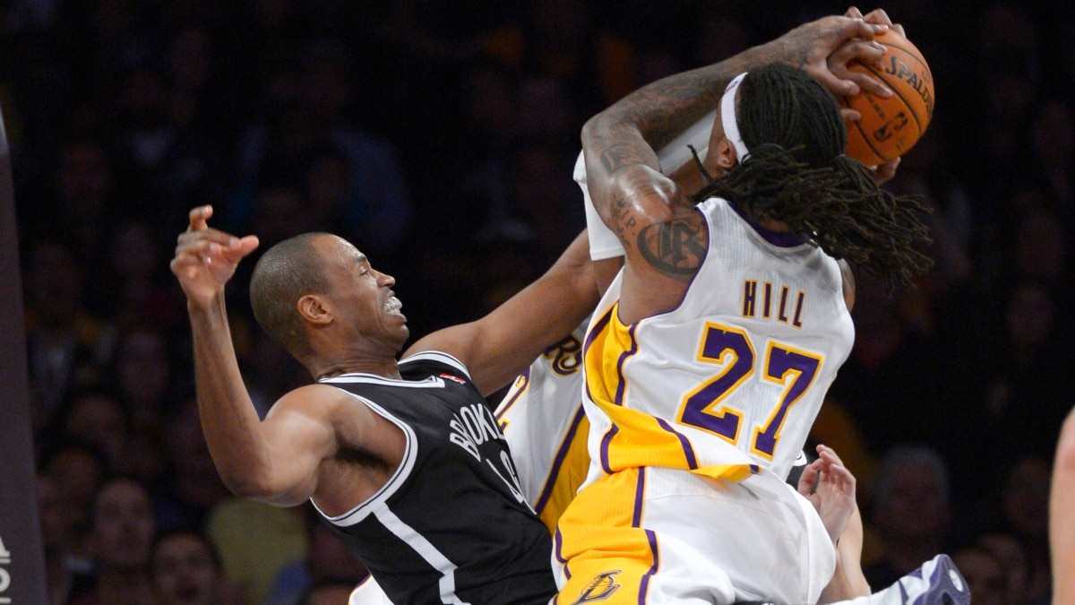 Commissioner Adam Silver congratulates Jason Collins on signing