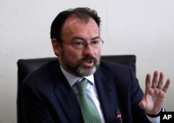 FILE - Mexico's Foreign Relations Secretary Luis Videgaray speaks to the press after meeting with Mexican senators in preparation for a trip to the U.S., where he will participate in talks with members of President Donald Trump's government, in Mexico City.