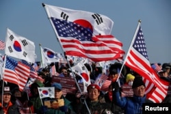 Demonstrators attend an anti-North Korea protest before the opening ceremony for the Pyeongchang 2018 Winter Olympics in Pyeongchang, South Korea, February 9, 2018.