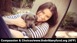 FILE - Brittany Maynard, shown with her Great Dane puppy, Charlie, took a lethal dose of medication prescribed by a doctor in Oregon on Saturday. Maynard was battling brain cancer.