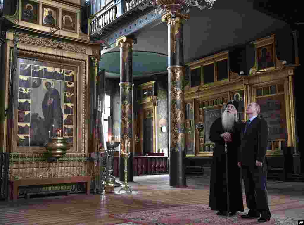 Russian President Vladimir Putin and Head of the Russian Orthodox Old-Rite Church Metropolitan Korniliy visit the Intercession cathedral of the Russian Orthodox Old-Rite Church in Moscow, Russia.