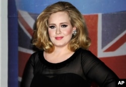 FILE - Adele arrives for the Brit Awards.